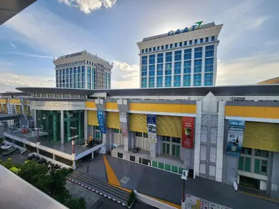 a building with two tall buildings in the background at RoomQuest IT Square Don Mueang Airport in Bangkok