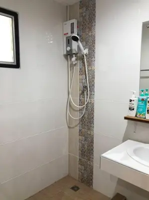 a shower in a bathroom with a sink at Maruay Living Apartment 401 (Khaosan/Chinatown/Samyot MRT) in Bangkok