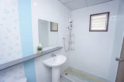 a white bathroom with a sink and a mirror at Maruay Living Apartment 506 (Khaosan/Chinatown/Samyot MRT) in Bangkok