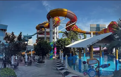a water park with a roller coaster and a water slide at The Parkland Condominium in Bangkok