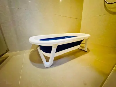 a bathroom with a toilet in the corner of a room at Cozy Spacious 1BR 2Bed GardenView 500m BTS Thonglo, Samitivej, SKV49, Rooftop Pool, Fast 500mbps wifi in Bangkok