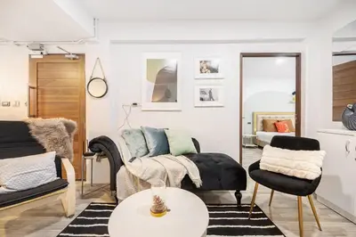 a living room with a couch and a table at Spacious 4BR Family Chatuchak Market 12 sleeps in Bangkok