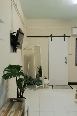 a room with a potted plant and a mirror at 204hideaway-Local Room with Street Food only 15 min walk to Skytrain in Bangkok