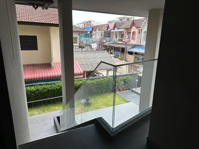 a view of a balcony from a window of a building at D Night Suite Hotel in Bangkok