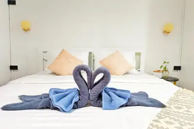 a bed with two towels in the shape of hearts at Getaway Villa Bangkok - 4 Bedroom,6 Beds and 5 Bathroom in Bangkok