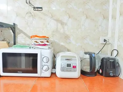 a microwave and a toaster on a counter at Getaway Villa Bangkok - 4 Bedroom,6 Beds and 5 Bathroom in Bangkok