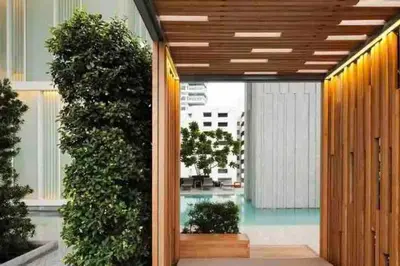 a view of a pool from the inside of a building at 2BedRoom-BestLocationBangkok-Emquartier-Metro-PhromPhong in Bangkok