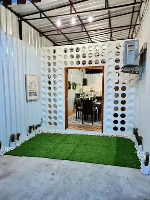 a room with a table and a green lawn at k4 be chill *Wongwianyai BTS_80m*Family&Friend* in Godown