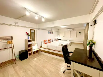 a large room with a bed and a desk and a desk at k4 be chill *Wongwianyai BTS_80m*Family&Friend* in Godown