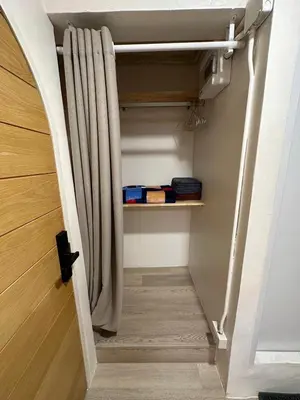a stairway with a shower curtain in a room at Letter Better Home in Bangkok