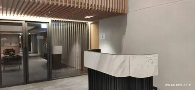 a lobby with a reception desk in a building at Tierra Residences in Bangkok