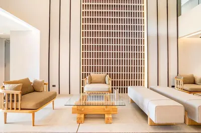 a living room with two couches and a coffee table at Tierra Residences in Bangkok