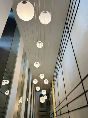 a row of lights on the ceiling of a building at Tierra Residences in Bangkok