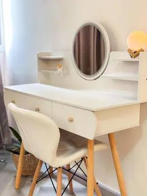 a white dressing table with a mirror and a chair at NK hostel 31 in Ban Bang Phang