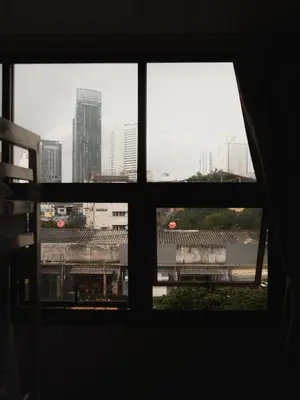 a view from a window of a train station at Krung Tone Hostel in Bangkok