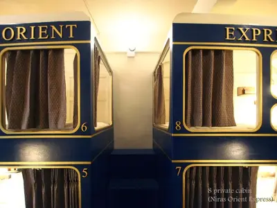 a blue train with the words orient express on it at Niras Bankoc Hostel in Bangkok