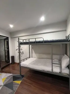 a bedroom with two bunk beds in a room at mstay in Bangkok