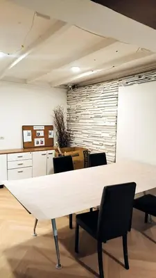 a meeting room with a white table and chairs at mstay in Bangkok