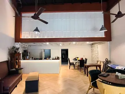 a living room with a dining room and a kitchen at mstay in Bangkok