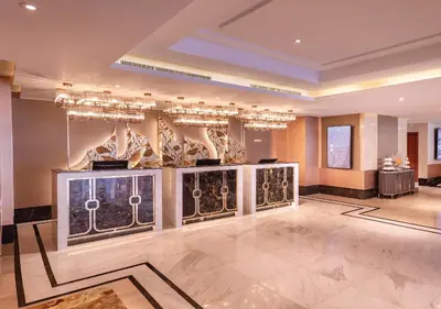 a large room with a chandelier and a lobby at SAMALA Hotel Bangkok in Bangkok