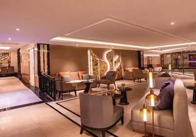 a lobby of a hotel with couches and chairs at SAMALA Hotel Bangkok in Bangkok
