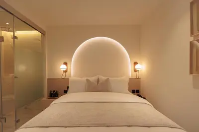 a bedroom with a large bed and a glass door at CORRIDOR 2407 in Bangkok