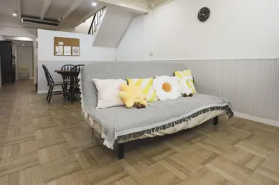 a couch with stuffed animals sitting on it at Nitichai Place, Private Sukhumvit Townhome 8PAX in Bangkok