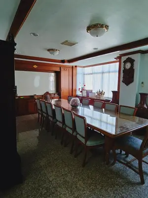 a dining room with a long table and chairs at Private rooms in Phatumwan Chula near Samyan, Chinatown, Jay-o Siam center, Central world middle of Bangkok in Bangkok
