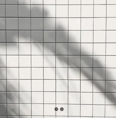 a white tile wall with grey clouds at 55th AREA in Nonthaburi