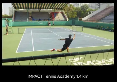 a man swinging a tennis racket on a tennis court at 55th AREA in Nonthaburi