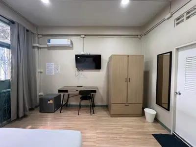 a room with a desk and a computer in it at Bangwa House - MRT Bangwa Station in Bangkok