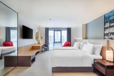 a hotel room with a bed and a desk at Best Western Click Sathorn 11 Bangkok in Bangkok