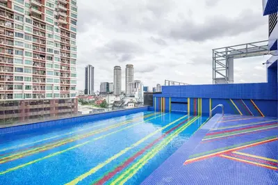 a swimming pool on the roof of a building at Best Western Click Sathorn 11 Bangkok in Bangkok