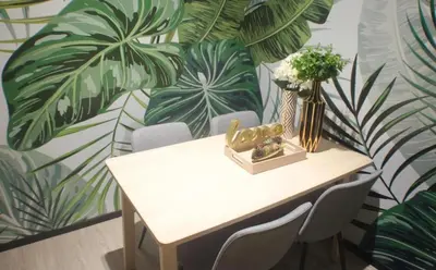 a table with a vase of flowers and plants on it at Resort Style Room Suksawat 64 Bangkok ND in Ban Tha Hin