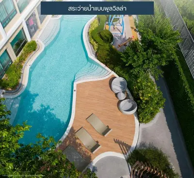 an overhead view of a swimming pool in a resort at Resort Style Room Suksawat 64 Bangkok ND in Ban Tha Hin