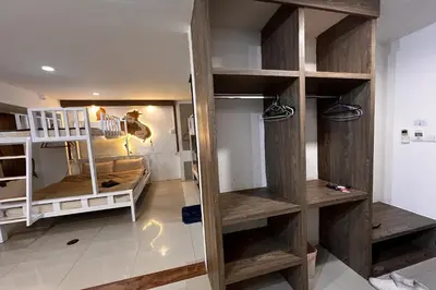 a room with wooden shelves in a room at Anh Anh Homestay in Bangkok