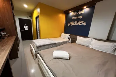 a hospital room with two beds and a sign on the wall at Anh Anh Homestay in Bangkok