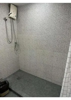 a shower stall in a bathroom with a shower at Affordable Serviced Apartments in Nana Omni Tower - Prime Sukhumvit location in Bangkok