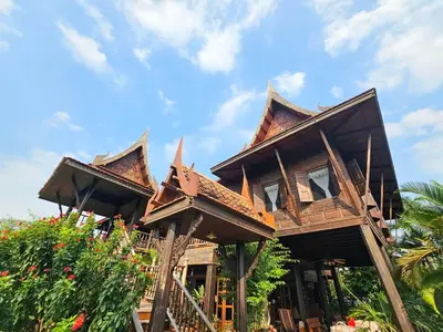 a house with a roof on top of it at The Thai House Homestay & Thai Cooking Experiences in Ban Bang Sano