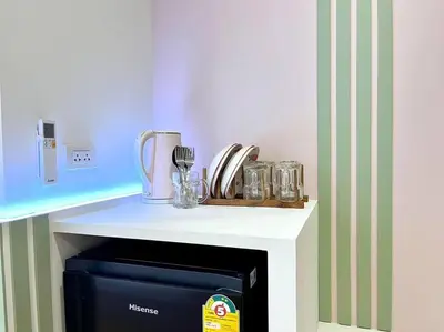 a kitchen with a counter top with a microwave at DiscoveryHome4 at Pratunammarket in Bangkok