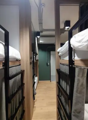 a hallway with bunk beds in a room at N5 Ratchawong Hostel in Bangkok