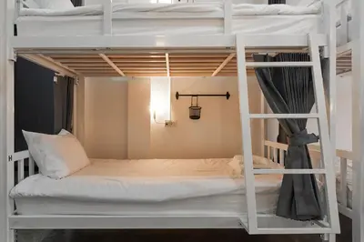 a room with two bunk beds in a room at G5 Hostel in Bangkok