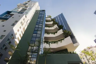 a building with plants on the side of it at MO Hotel Bangkok in Bangkok