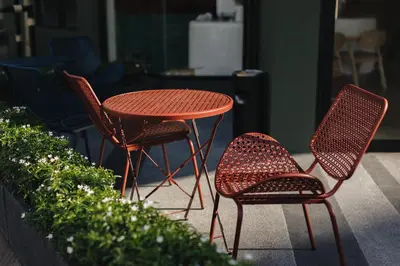 two chairs and a table and a table and two chairs at MO Hotel Bangkok in Bangkok