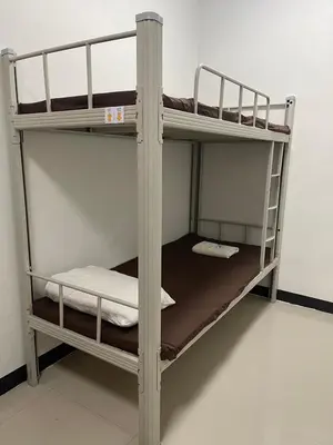 a couple of bunk beds in a room at OYO 75577 Palace Hostel in Amphoe Phra Khanong