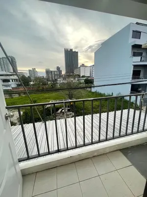 a balcony with a view of a city at OYO 75577 Palace Hostel in Amphoe Phra Khanong