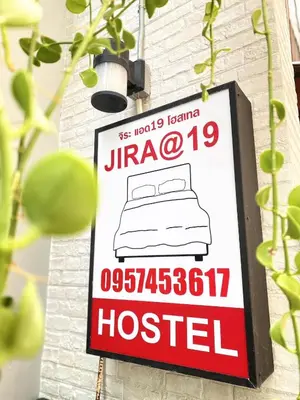 a sign for a hospital hanging on a wall at Jira19Hostel in Bangkok