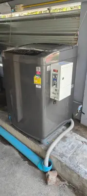 a metal appliance sitting on a cart on the ground at 812 Quiet AC Apartment with Balcony & free Wifi in Bangkok