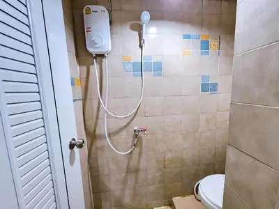 a shower in a bathroom with a toilet at 814-STP Homely room Free Wi-Fi and Near BTS line in Bangkok