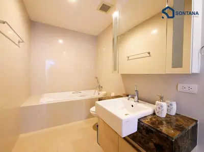 a bathroom with a sink and a bath tub at Expansive Modern - BTS Phrom Phong - Ultra Fast WiFi in Khlong Toei